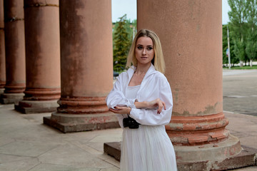 Fashion look's woman. Young woman modern portrait. Young woman dressed in white skirt and shirt...