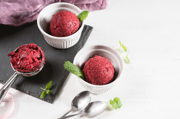 Berry ice cream or sorbet on rustic background