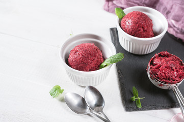 Berry ice cream or sorbet on rustic background