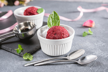 Berry ice cream or sorbet on rustic background