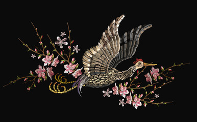 Japanese crane bird and sakura flowers. Embroidery. Asian ethnic template for clothes, t-shirt design © Matrioshka