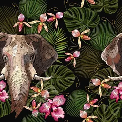 Tapeten Embroidery elephants heads and tropical flowers seamless pattern. Indian jungle style. Wildlife art. Template for clothes, textiles, t-shirt design © Matrioshka