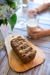 Vegan banana bread with green buckwheat and glass oat milk.