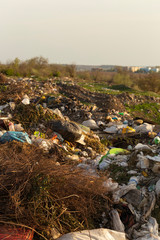 Environmental disaster. Clogging the outskirts of the city. Garbage heaps are an element of the modern European landscape.