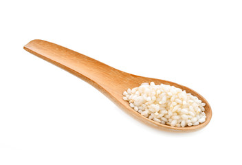 rice seeds In wooden spoon on white background