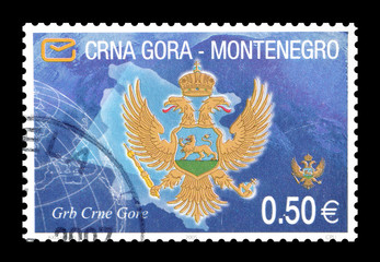 Cancelled postage stamp printed by Montenegro, that shows Coat of Arms, circa 2007.