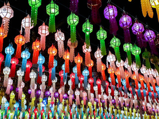 Colorful perspective and look up view of Thai Lanna style lanterns to hang in front of the temple on night time in Loy Kratong Festival.