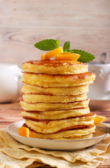 Pile of pancakes with honey