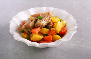 Ribs, potato, carrot and pea stew