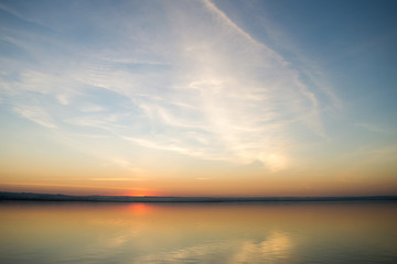 Beautiful red sunset over lake. Composition of nature.