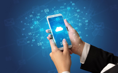 Female hand using smartphone with cloud, message and global concept
