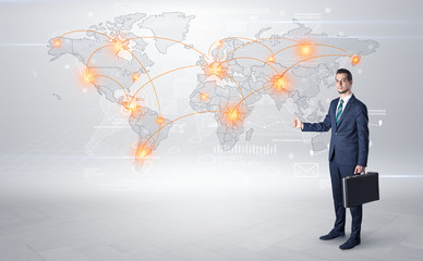 Businessman in dark suit hitchhike to business trip in a front of a map with destination