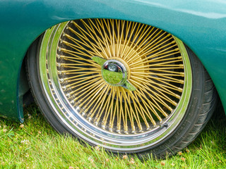 Low profile tires and gold colored spokes rims