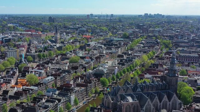 Aerial view of cityscape of Amsterdam, capital city of Netherlands, historic centre, The Oude Church (De Oude Kerk) - landscape panorama of Europe from above