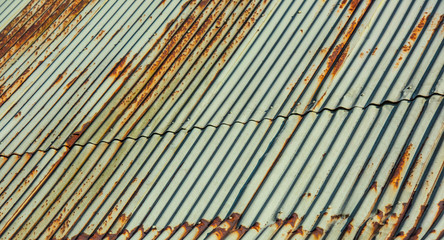 Weathered green and rusty tin roof.