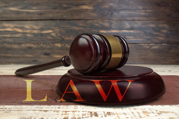 Law and Justice, Legality concept, Judge Gavel on a wooden background, Law library concept.