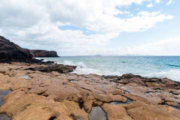 Fototapeta premium Panorama of beautiful beach and tropical sea of Lanzarote. Canaries
