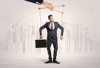 Puppet man with big city great power concept
