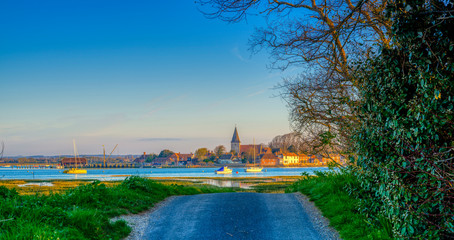 Sunrise over Bosham harbour and village, West Sussex, UK