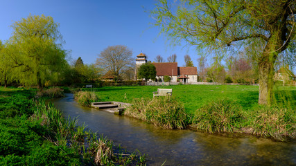 Spring sunshine on St Andrew's Church in Meonstoke in the South Downs National Park, Hampshire, UK