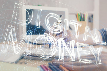 Cryptocurrency hologram, bitcoin, ico theme over hands taking notes background. Concept of...