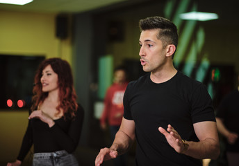 Dance instructors of salsa and bachata at their class