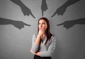 Young innocent  student with pointing hands concept
