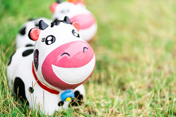 Cow stucco dolls on playground with copy space. so cute. kids are like this.