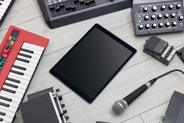 Empty tablet and electronic music instruments 
