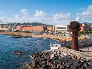 Naples, Campania, Italy: panorama of the beach of Bagnoli with an artistic steel installation, an...