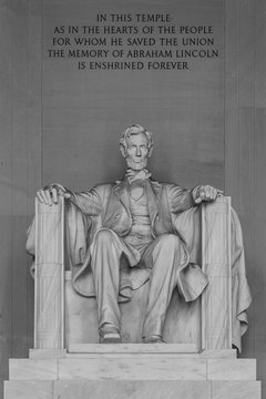 WASHINGTON, DC - AUGUST 06, 2014: The Lincoln Statue, the Lincoln Memorial, white marble, medium shot seated