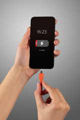 Elegant hand charging smartphone with low battery
