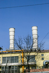 2010.04.11, Moscow, Russia. Factory pipes on background of blue sky. Concept of pollution atmosphere. 