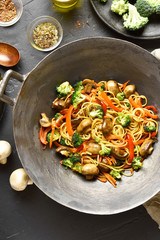 Stir-fry noodles with vegetables in wok