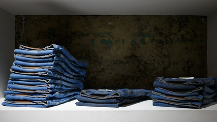 stack of blue jeans