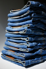 stack of blue jeans