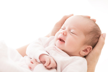 Fototapeta Newborn Baby Sleep on Mother Hands, New Born Girl Smiling and Sleeping, Happy Two Weeks Old Child on White obraz