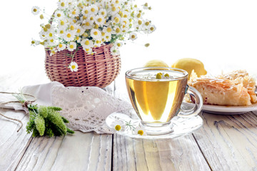 Chamomile tea on a wooden table