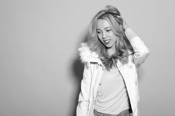 Fototapeta premium young beautiful girl in a white jacket