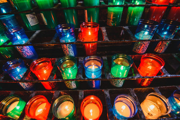 Many colorful candles in the Benedictine abbey Santa Maria de Montserrat 