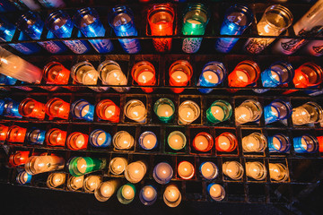 Many colorful candles in the Benedictine abbey Santa Maria de Montserrat 