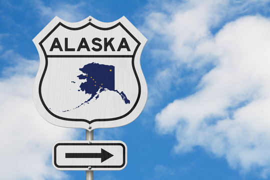 Alaska map and state flag on a USA highway road sign