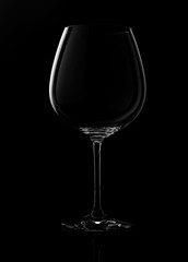empty wine glass isolated on a dark background