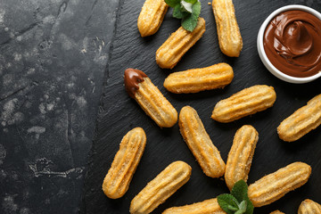 Churros with chocolate dipping sauce. sugar and cinnamon.