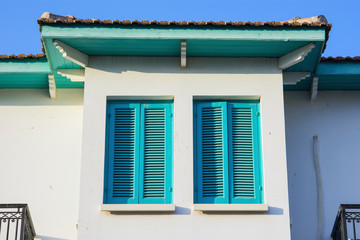 Fototapeta na wymiar Sunny house detail with windows