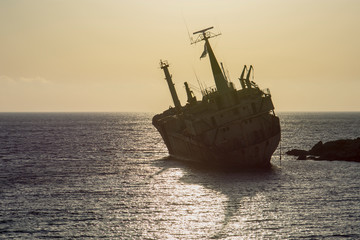 Stranded ship at sunset
