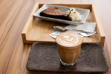 Hot latte on a wooden table
