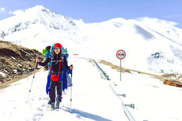 The girl goes to the base camp under the Mount Elbrus. North Caucasus Russia.