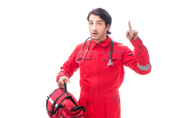 Young paramedic in red uniform isolated on white 
