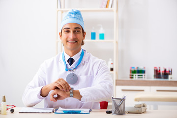 Young male doctor otolaryngologist working at the hospital 